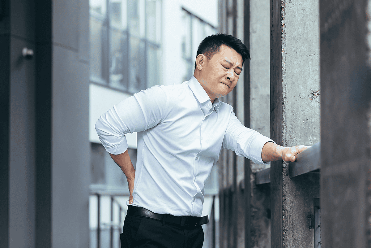 Tired Asian Businessman Near Office Doing Back Massage Has Severe Back Pain Boss Break