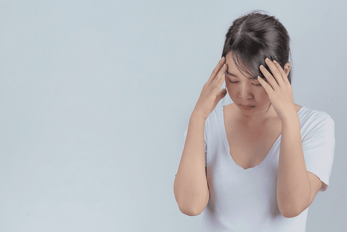 Woman Showing Signs Stress Gray Wall